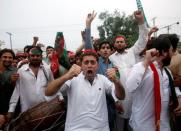 Opponents of Pakistan's Prime Minister Nawaz Sharif react after the Supreme Court's decision to disqualify Sharif, in Peshawar, Pakistan July 28, 2017. REUTERS/Fayaz Aziz