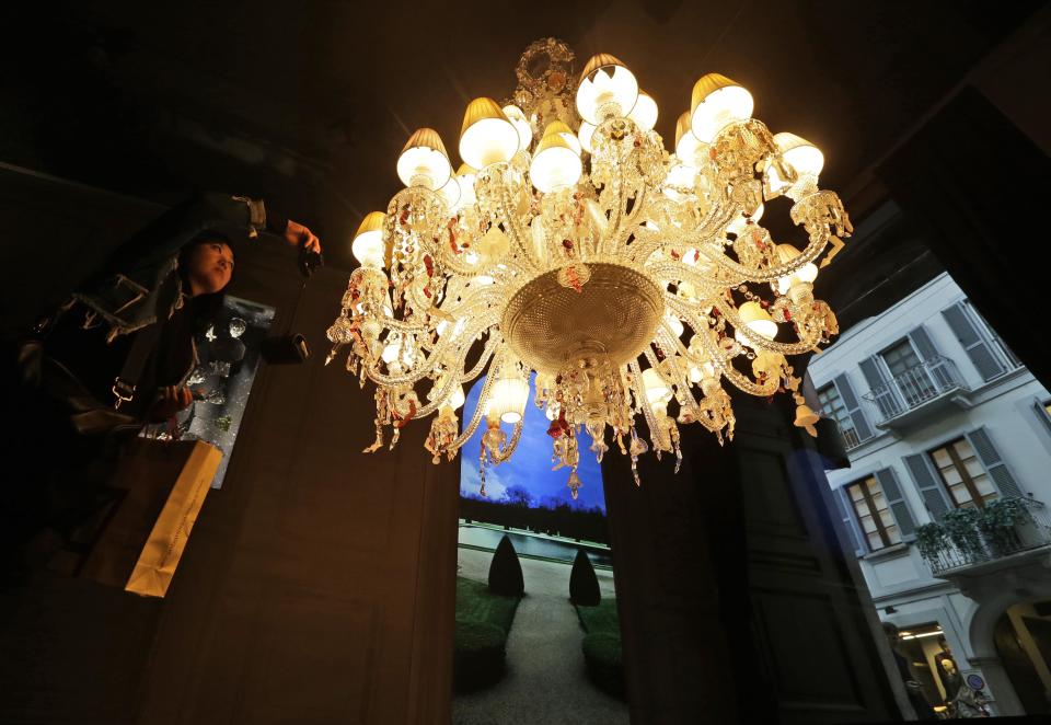 A crystal chandelier designed by French designer Philip Stark for Baccarat is displayed at Milan's Design Fair, in Milan, Italy, Thursday, April 11, 2013. The Milan furniture and design week fair, showcasing the latest in furniture and design from countries around the world, will continue until Sunday. (AP Photo/Luca Bruno)