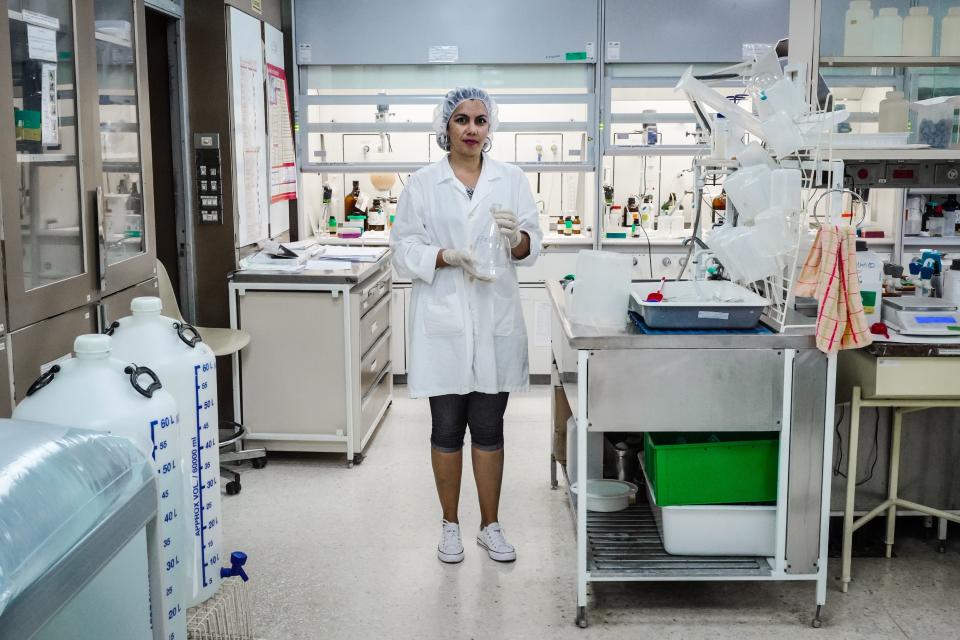 Yordanka Masfollor, 34,&nbsp;has a Ph.D. in chemical sciences. Here she poses for a picture at a biotechnology laboratory in Havana on March 2, 2018.