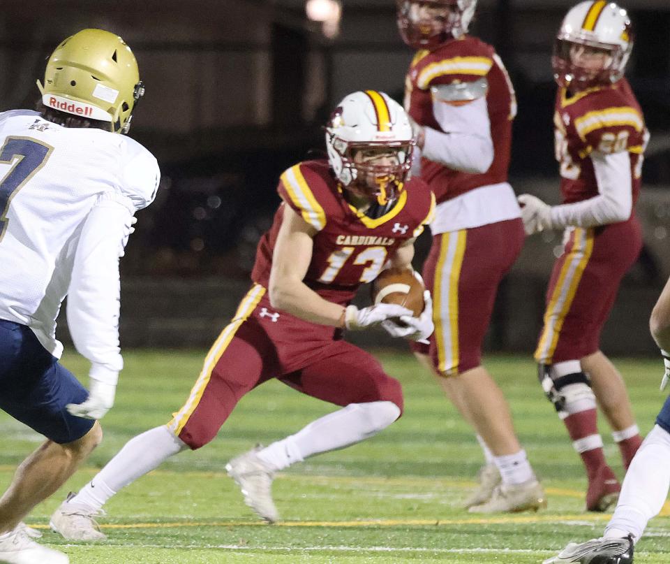 Cardinal Spellman's Brian Gallagher carries the football during a game versus Archbishop Williams on Wednesday, Nov. 24, 2021.