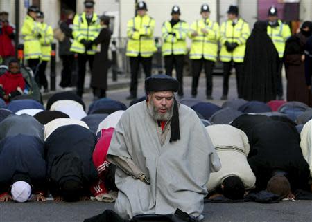 Muslim cleric, Abu Hamza al-Masri, is seen leading prayers outside the North London Central Mosque, in Finsbury Park, north London in this January 24, 2003 file photograph. REUTERS/Toby Melville/Files
