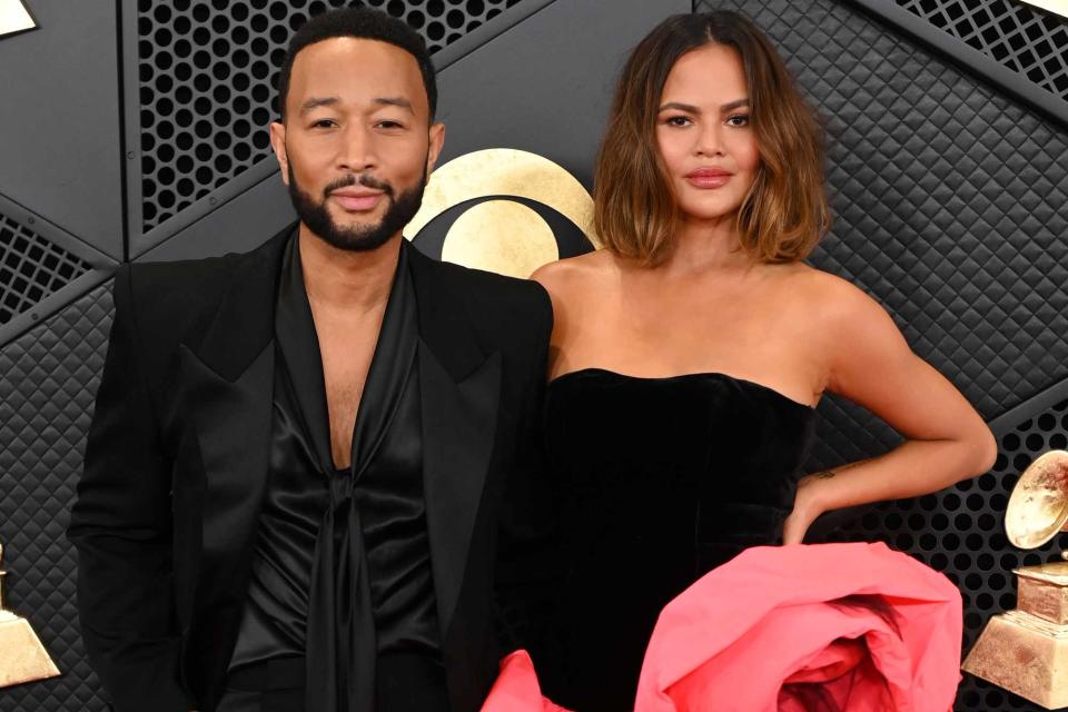 <p>David Fisher/Shutterstock</p> Chrissy Teigen and John Legend at the 2024 Grammys