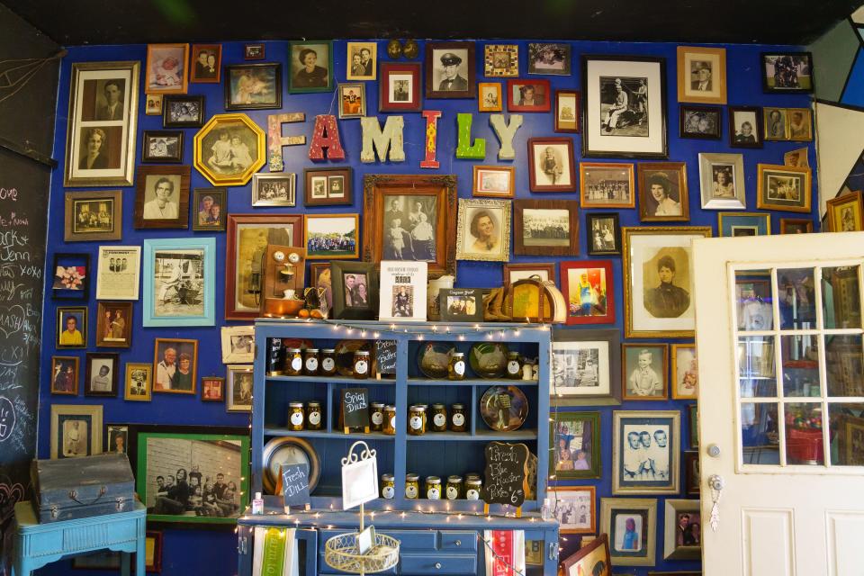 Wall decorated with family photos at Blue Rooster Produce on Nov. 19, 2022 in Peoria, AZ.