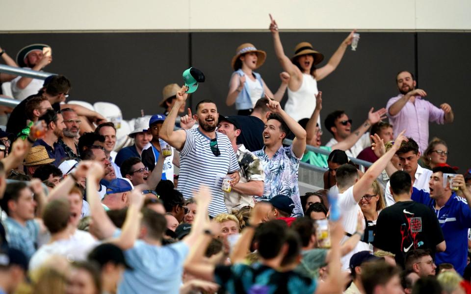 Spectators in the stands celebrate during The Hundred match at The Kia Oval, London. Picture date: Thursday July 22, 2021 - The Hundred debates booze-free zones at the Oval after rowdy scenes in opening men's match - PA