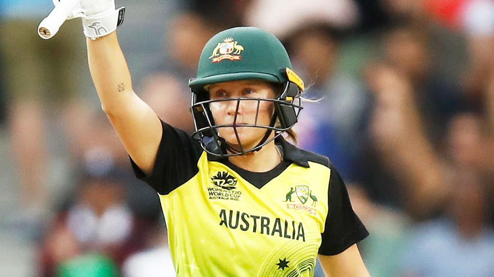 Alyssa Healy raises her bat after a great. knock for Australia in the T20 World Cup.