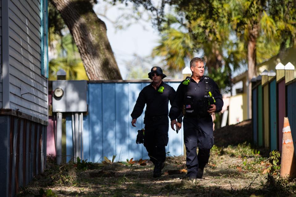 A crew from the Miami-Dade Fire Rescue go door to door checking on residences in Steinhatchee, Fla. following Hurricane Idalia on Wednesday, Aug. 30, 2023.