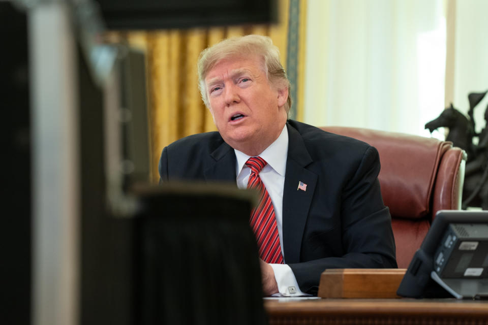 President Trump on a video conference from behind his desk in the Oval Office.