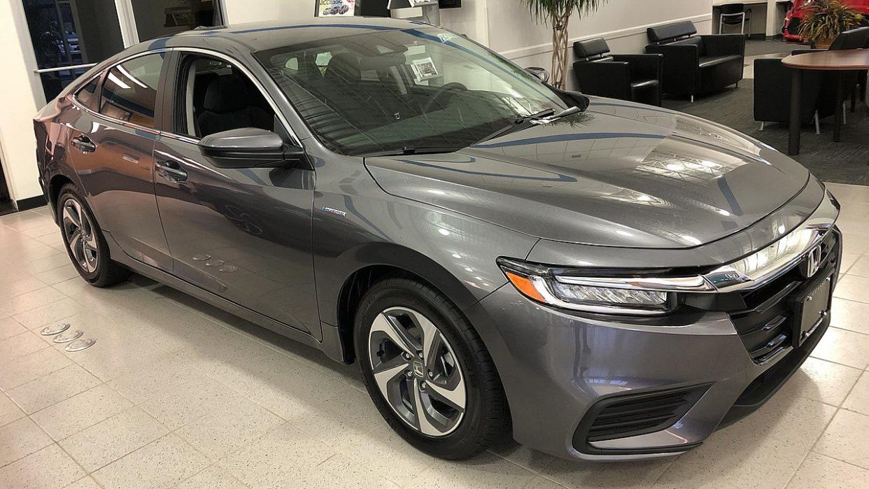 Dark silver Honda Insight in show room