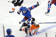 New York Rangers defenseman Braden Schneider (4) collides with Philadelphia Flyers right wing Garnet Hathaway (19) during the third period of an NHL hockey game Thursday, April 11, 2024, at Madison Square Garden in New York. (AP Photo/Mary Altaffer)