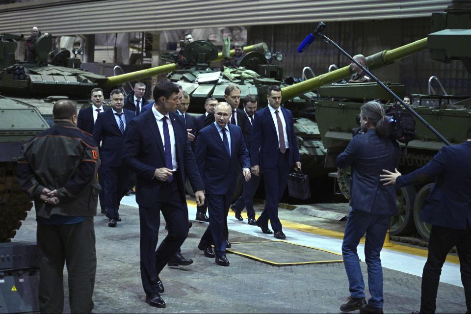 FILE - Russian President Vladimir Putin visits the Uralvagonzavod factory in Nizhny Tagil, Russia, Thursday, Feb. 15, 2024. The economy's resilience in the face of bruising Western sanctions is a major factor behind President Vladimir Putin's grip on power in Russia. (Ramil Sitdikov, Sputnik, Kremlin Pool Photo via AP, File)