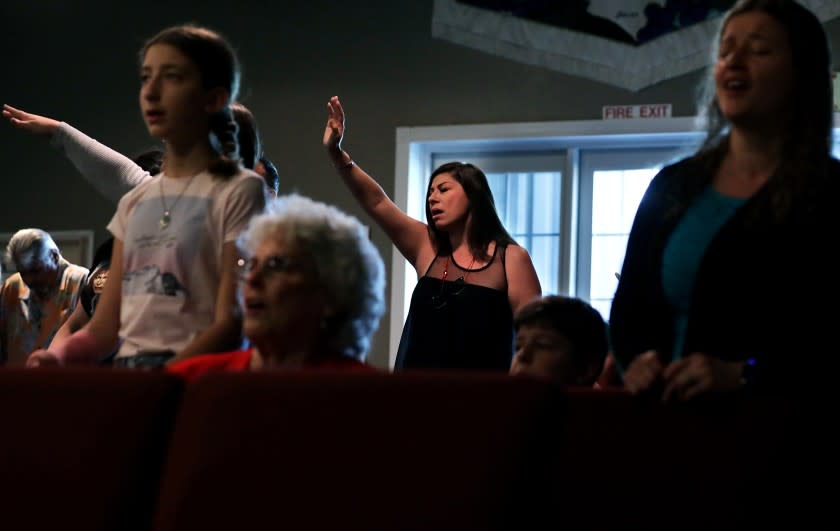 WILDOMAR-CA-JULY 26, 2020: Worshippers including Cindy Medina, center, gather for church service at Bundy Canyon Christian Church in Wildomar on Sunday, July 26, 2020.(Christina House / Los Angeles Times)