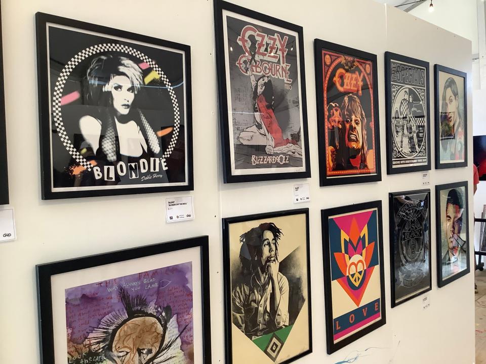 Poster art from artists including muralist Shepard Fairey were on display as part of the Art and Sound exhibit hosted by Artists for Trauma at Louder Than Life 2023 at the Highland Festival Grounds in Louisville, Kentucky, on Sept. 22, 2023