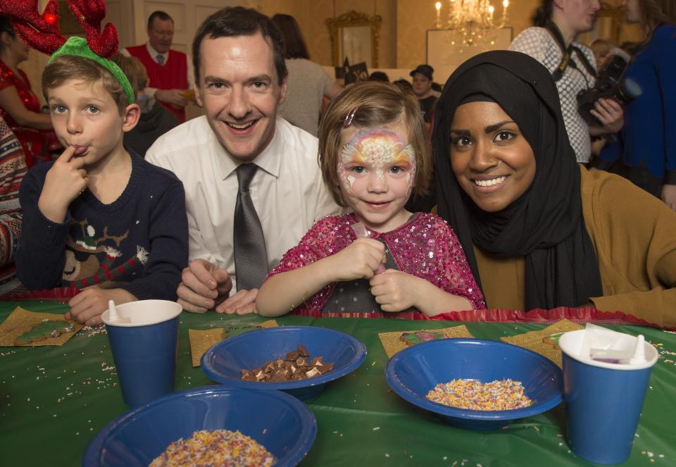 The Chancellor of the Exchequer George Osborne with Great British Bake off winner Nadiya Hussain (right), Jacob Howes, six, from Essex and Martha Hanlon, four, from Oxfordshire, as he hosted the Starlight Children's Foundation Christmas party, at number 11, Downing Street in Westminster, central London.