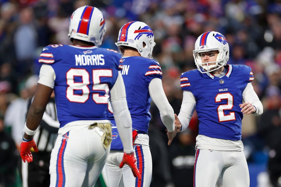 ORCHARD PARK, NEW YORK - NOVEMBER 19: Tyler Bass #2 of the Buffalo Bills celebrates with teammates after kicking a field goal in the first quarter against the New York Jets at Highmark Stadium on November 19, 2023 in Orchard Park, New York. (Photo by Sarah Stier/Getty Images)