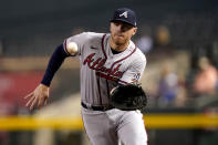 Atlanta Braves Freddie Freeman fields a ground out hit by Arizona Diamondbacks David Peralta during the first inning of a baseball game, Monday, Sept. 20, 2021, in Phoenix. (AP Photo/Matt York)