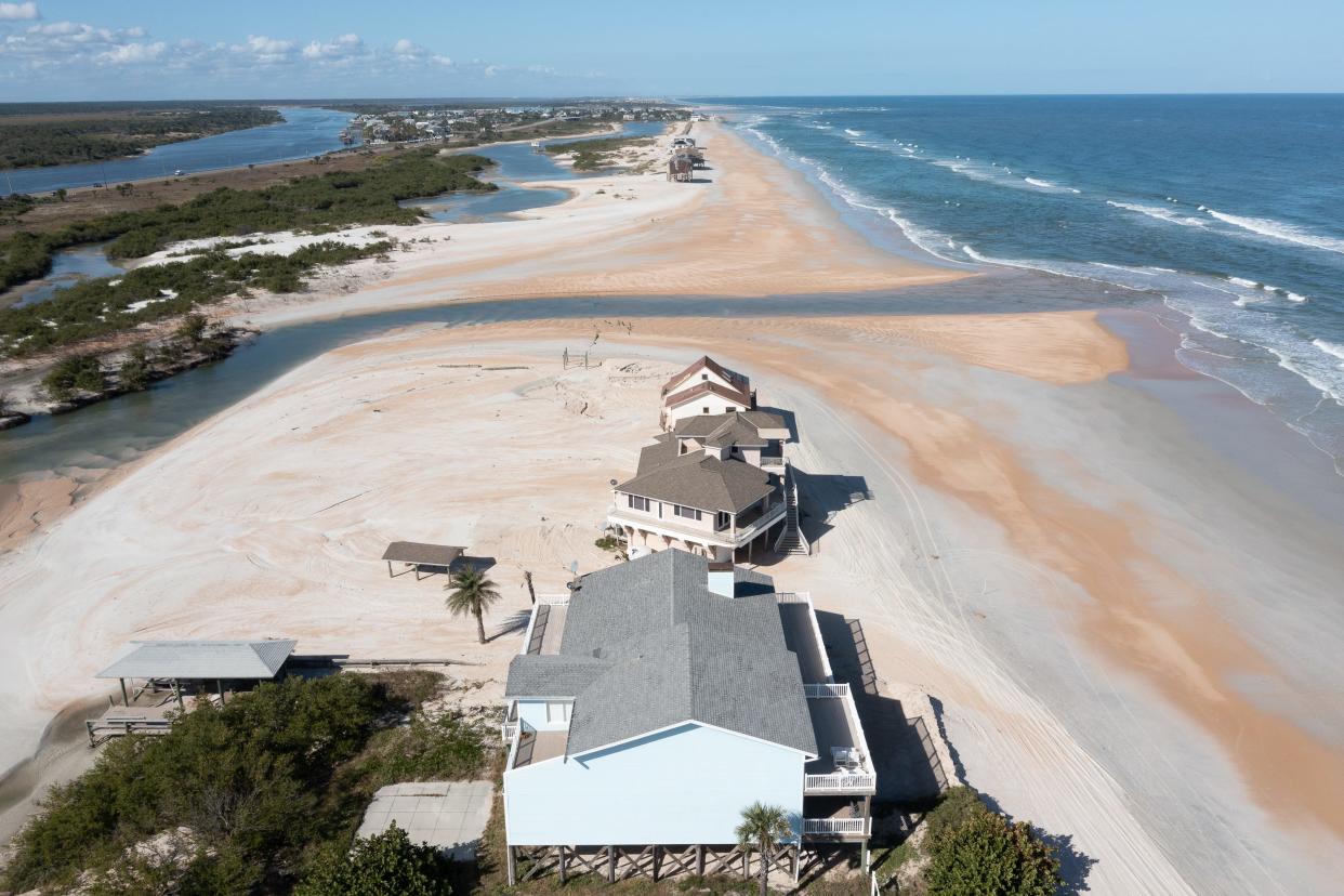 Water flows from the Atlantic Ocean into the Summer Haven River, south of the Matanzas Inlet, on Wednesday, Nov. 17, 2021, through a breach caused by a nor'easter on Nov. 5 and 6.