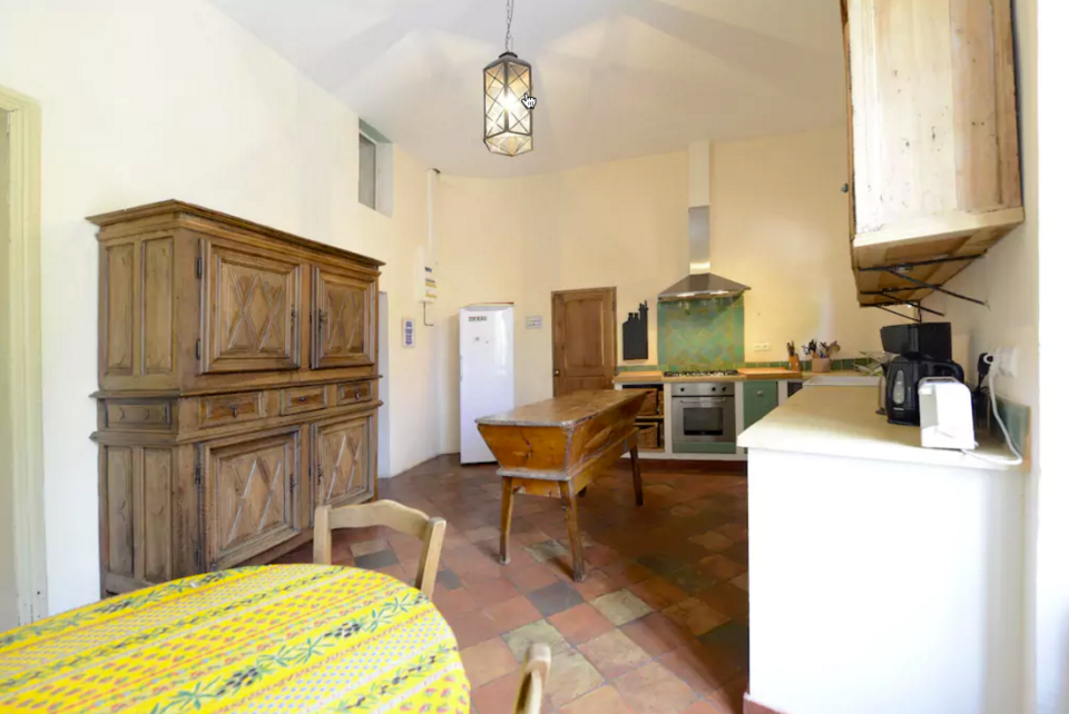 <p>Here’s the kitchen, which (don’t worry) has modern appliances. (Airbnb) </p>