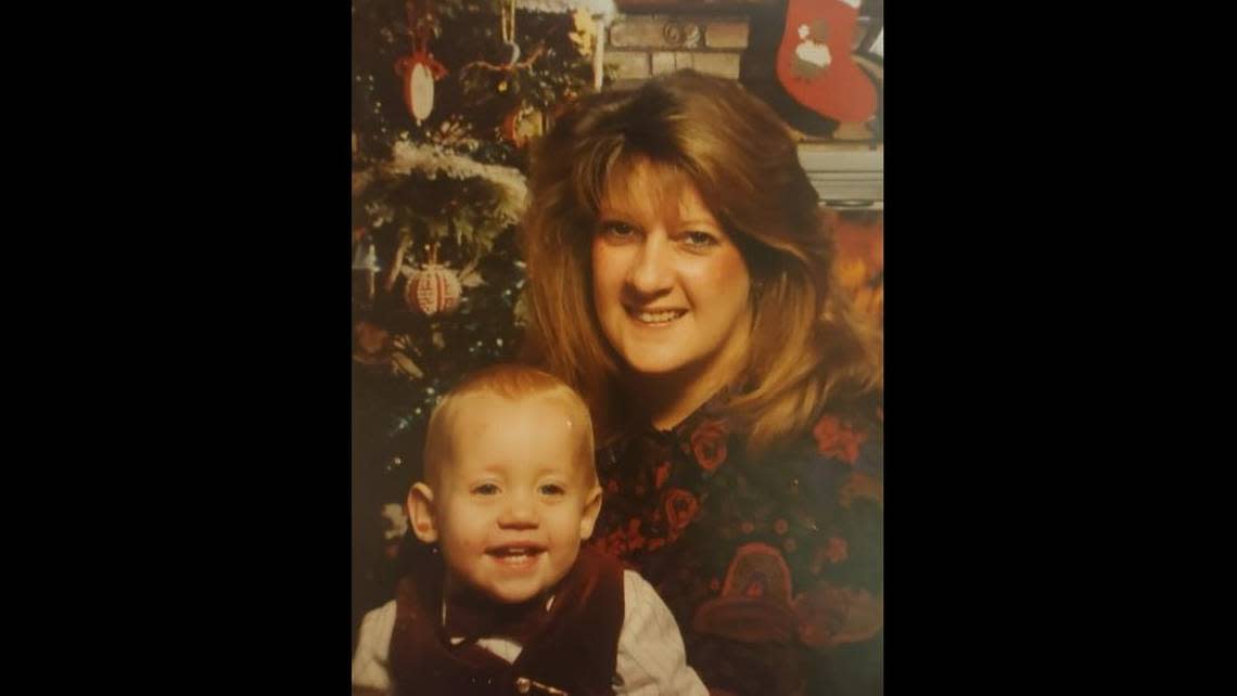 Taylor Hawkins, left, is pictured beside his mother Celeste Hawkins for a Christmas portrait in the early 1990s. The younger Hawkins, now 31, of Platte City, was shot and killed on June 28 in rural Platte County.
