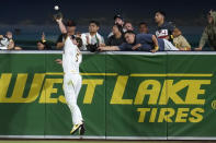 San Diego Padres right fielder Wil Myers makes the catch over the wall for the out on San Francisco Giants' Steven Duggar during the eighth inning of a baseball game Tuesday, Sept. 21, 2021, in San Diego. (AP Photo/Gregory Bull)