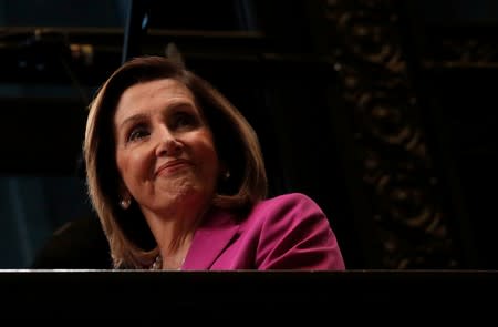 FILE PHOTO: U.S. House Speaker Nancy Pelosi (D-CA) looks down from a balcony during an interview with CNBC at the NYSE in New York