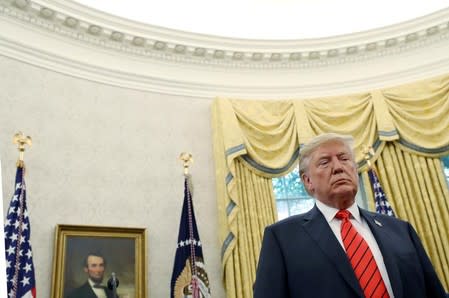 FILE PHOTO: U.S. President Trump attends ceremonial swearing-in for Labor Secretary Scalia at the White House in Washington