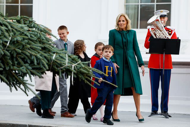 <p>Anna Moneymaker/Getty</p> First lady Jill Biden was joined by military-connected families at the White House to receive the official 2023 Christmas tree