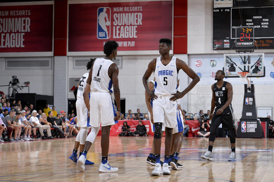 Jonathan Isaac, left, and Mo Bamba share the floor during a summer league game. (Getty)