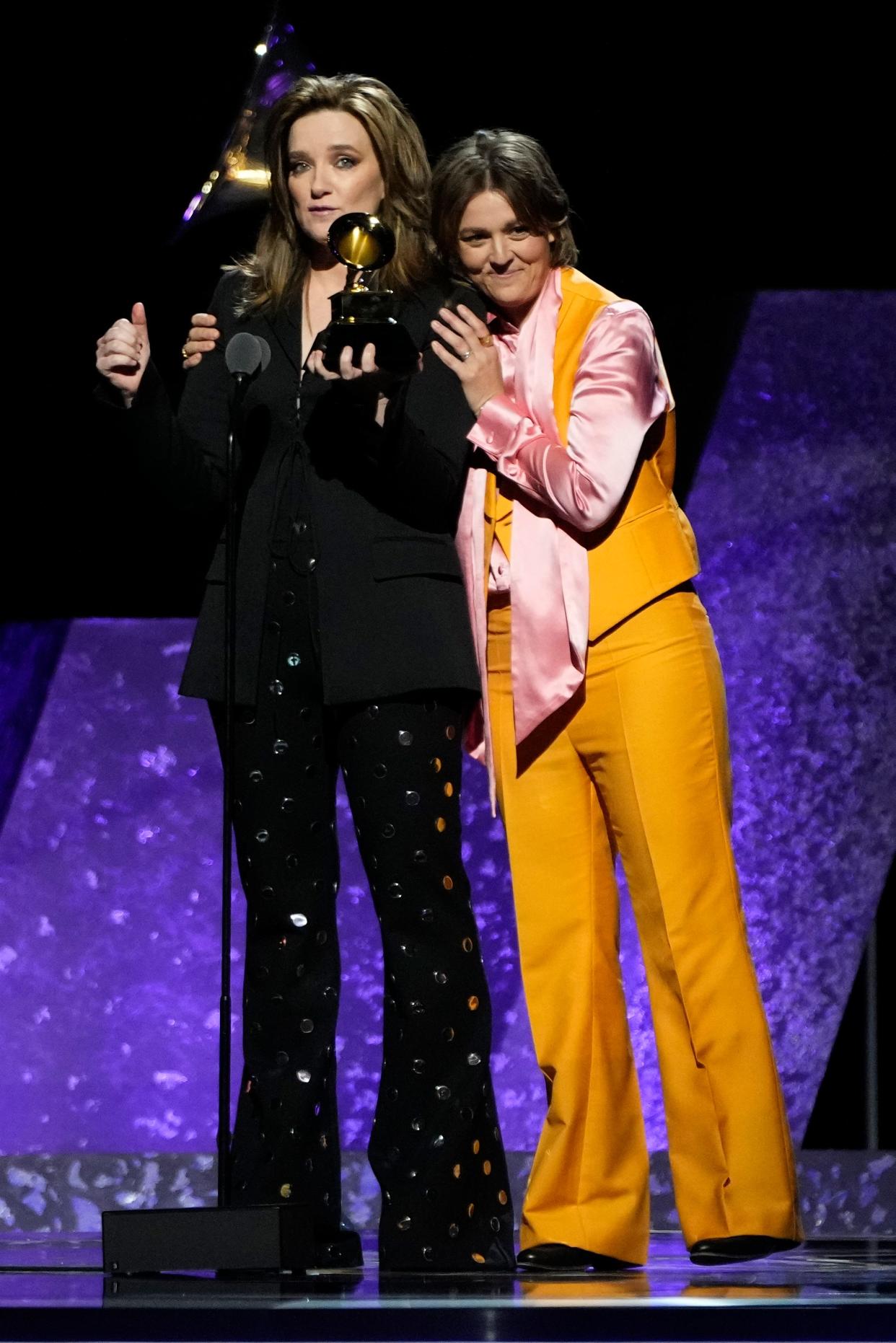 Brandy Clark (left) and Brandi Carlile accept the award for Best Americana Performance during the 66th Annual GRAMMY Awards Premiere Ceremony at the Peacock Theater in Los Angeles on Sunday, Feb. 4, 2024.