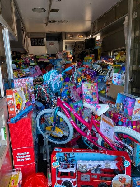 Toys for Tots donations fill a Uhrichsville Fire Department ambulance.