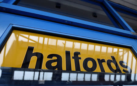 FILE PHOTO: A sign is seen on the front door of a branch of Halfords in west London, Britain July 15, 2015. REUTERS/Toby Melville/File Photo