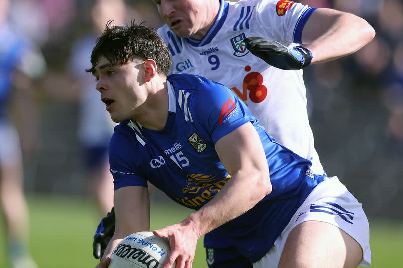 Cavan's Oisin Brady in action against Monaghan's Darren Hughes