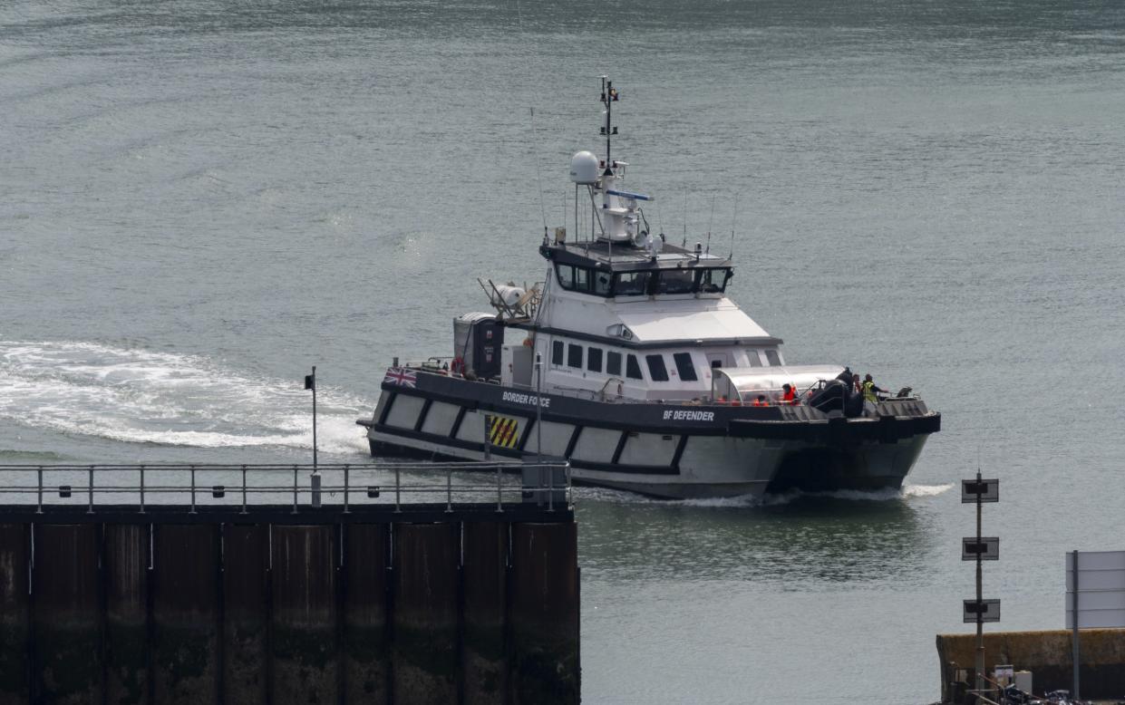 A group of people thought to be migrants are brought in to Dover