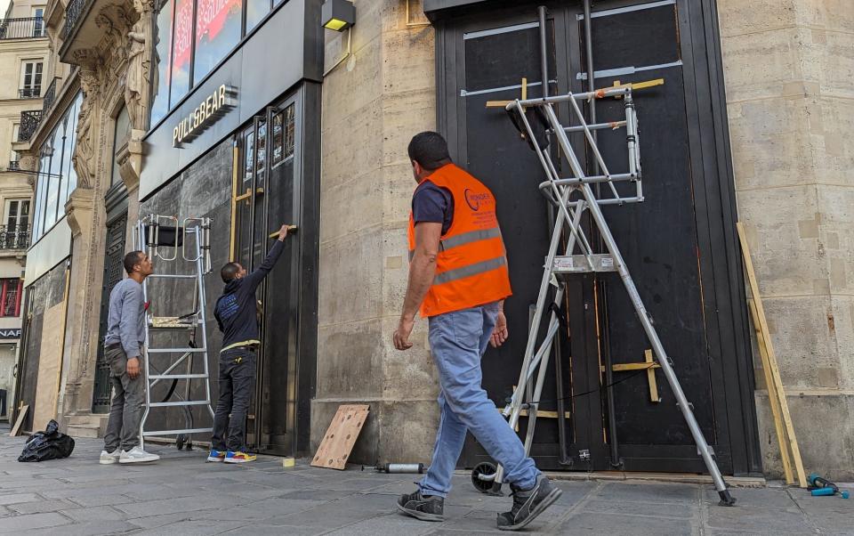 PARIS, FRANCE - JULY 06: Dozens of stores are barricaded themselves on the eve of the second round of parliamentary elections, in anticipation of possible protests after the results are announced in Paris, France on July 06, 2024. Several sectors are concerned, including the Rue de Rivoli, the Opera area and Champs-Elysees. The French Ministry of the Interior has announced the deployment of 30,000 police officers across France, including 5,000 in Paris, to deal with possible unrests. (Photo by Luc Auffret/Anadolu via Getty Images)