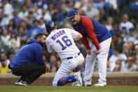 Chicago Cubs' Patrick Wisdom (16) is checked on by manager David Ross right, during the second inning of a baseball game against the Cleveland Indians Tuesday, June 22, 2021, in Chicago. Chicago won 7-1. (AP Photo/Paul Beaty)