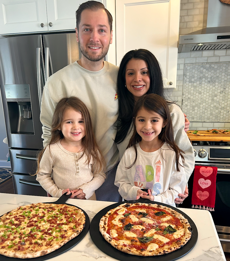 'Backyard Pizza Dad' Daniel Piasecki with his wife Victoria and daughters, Natalia (L) and Alessia (R).