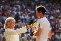 LONDON, ENGLAND - JULY 07: Andy Murray of Great Britain speaks with Sue Barker as he holds the Gentlemen's Singles Trophy following his victory in the Gentlemen's Singles Final match against Novak Djokovic of Serbia on day thirteen of the Wimbledon Lawn Tennis Championships at the All England Lawn Tennis and Croquet Club on July 7, 2013 in London, England. (Photo by Clive Brunskill/Getty Images)