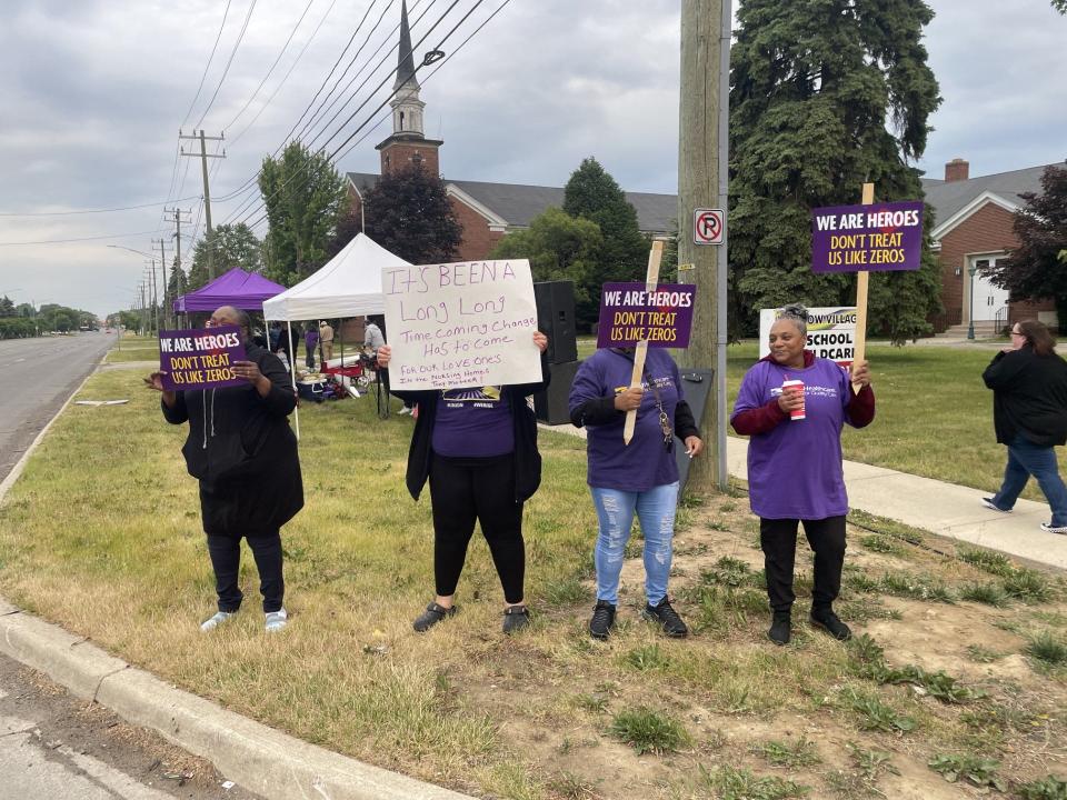 Striking workers at the Orchards at Redford and SEIU Healthcare Michigan staff on the strike line outside the Redford Township nursing home on June 13, 2023.