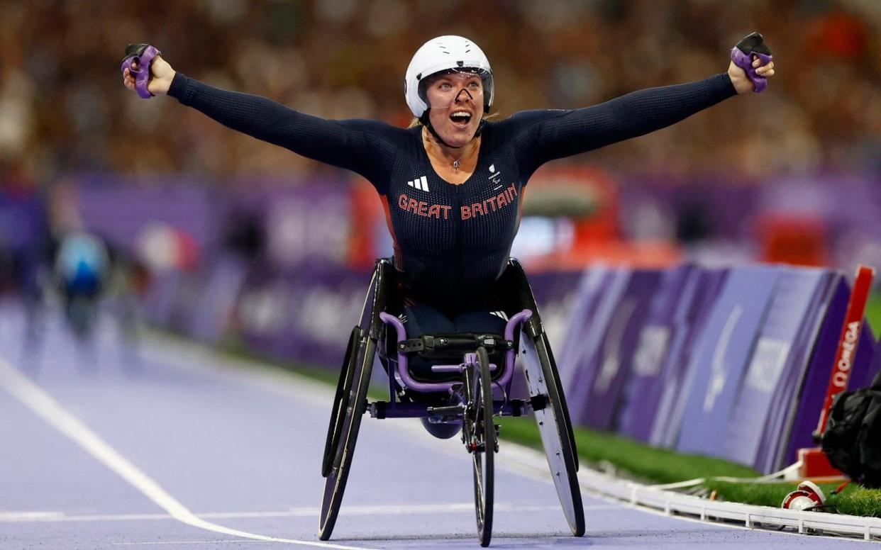 Hannah Cockroft of Britain reacts after crossing the line to win gold