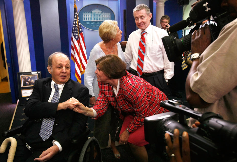 Bill Plante and other White House correspondents greet James Brady during a visit to the briefing room in 2009. Brady was wounded in John Hinckley’s assassination attempt on President Ronald Reagan in 1981. - Credit: (Photo by Alex Wong/Getty Images)