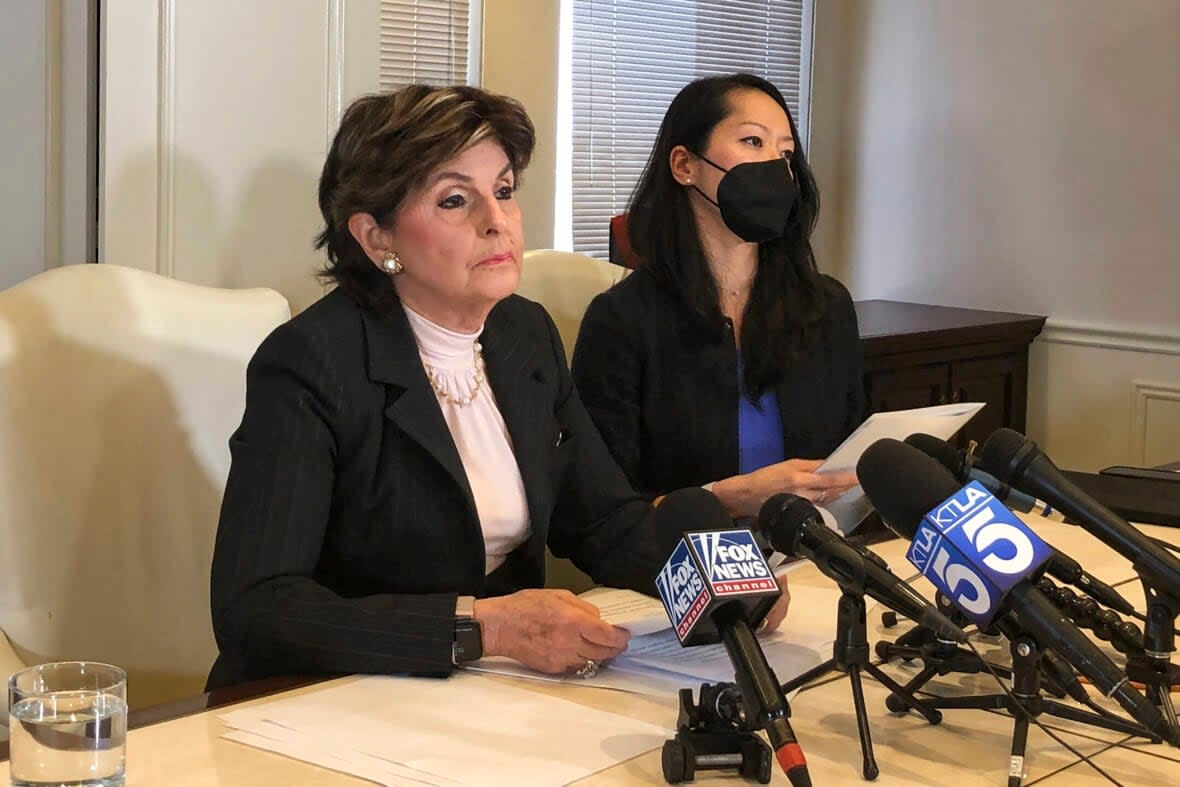 Attorney Gloria Allred, left, and her law partner, Christina Cheung, discuss the allegations that Herschel Walker drove their client to have an abortion, during a news conference in Los Angeles Wednesday, Oct. 26, 2022. (AP Photo/Stefanie Dazio)