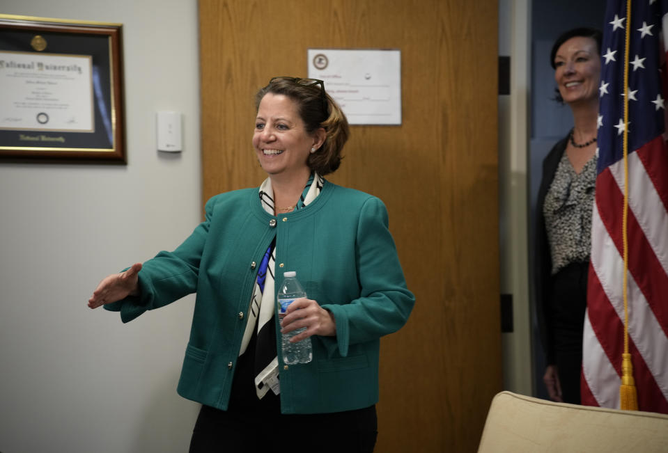 Deputy Attorney General Lisa Monaco, left, and Colette Peters, director of the federal Bureau of Prisons, enter an interview with The Associated Press Tuesday, April 25, 2023, in Aurora, Colo. Sexual abuse in the nation’s federal prisons must be rooted out, the Justice Department's second-highest-ranking leader told prison wardens gathered for their first nationwide training since revelations that a toxic, permissive culture at a California prison allowed abuse to run rampant. (AP Photo/David Zalubowski)