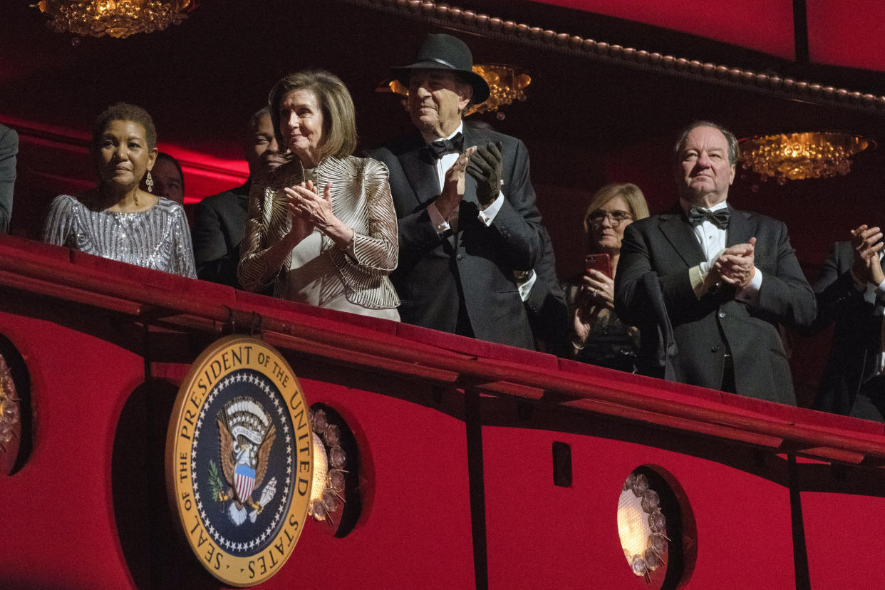 FILE - House Speaker Nancy Pelosi of Calif., and her husband Paul Pelosi attend the 45th Kennedy Center Honors at the John F. Kennedy Center for the Performing Arts in Washington on Dec. 4, 2022. The state court case continues against the man accused of breaking into House Speaker Nancy Pelosi's home, beating her husband and seeking to kidnap her. Suspect David DePape's preliminary hearing is scheduled for Wednesday, Dec. 14, 2022. (AP Photo/Manuel Balce Ceneta, File)
