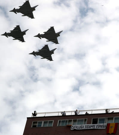 Eurofighter jets take part in a flypast as part of celebrations to mark Spain's National Day in Madrid, Spain October 12, 2017. REUTERS/Sergio Perez