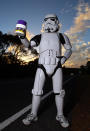 PERTH, AUSTRALIA - JULY 15: Stormtrooper Paul French is pictured on day 5 of his over 4,000 kilometre journey from Perth to Sydney holding his collection tin on Old Mandurah Road on July 15, 2011 in Perth, Australia. French aims to walk 35-40 kilometres a day, 5 days a week, in full Stormtrooper costume until he reaches Sydney. French is walking to raise money for the Starlight Foundation - an organisation that aims to brighten the lives of ill and hostpitalised children in Australia. (Photo by Paul Kane/Getty Images)
