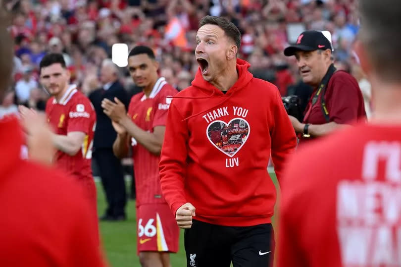 Pep Lijnders calls out to the Liverpool fans as he makes his way out onto the pitch at Anfield for his farewell presentation