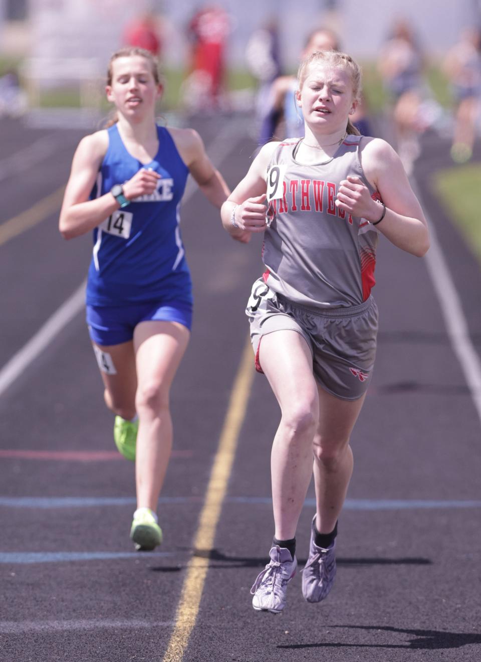 Northwest's Madelyn Begert (right) wins the girls 1,600 meters at this year's Stark County Track and Field Championships.
