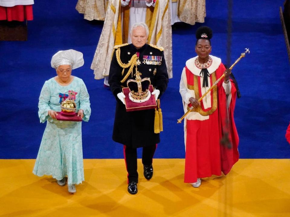 The Orb, the Sceptre with Dove and the Imperial State Crown are brought to the thrones before the coronation of King Charles III and Queen Camilla at Westminster Abbey, on May 6, 2023 in London, England.