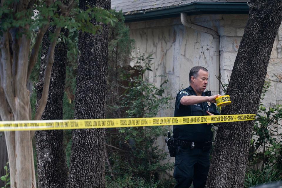 Austin police work at the scene on Bernoulli Drive where Austin police officer Jorge Pastore was killed early Saturday by a man identified as Ahmed Mohamed Nassar.