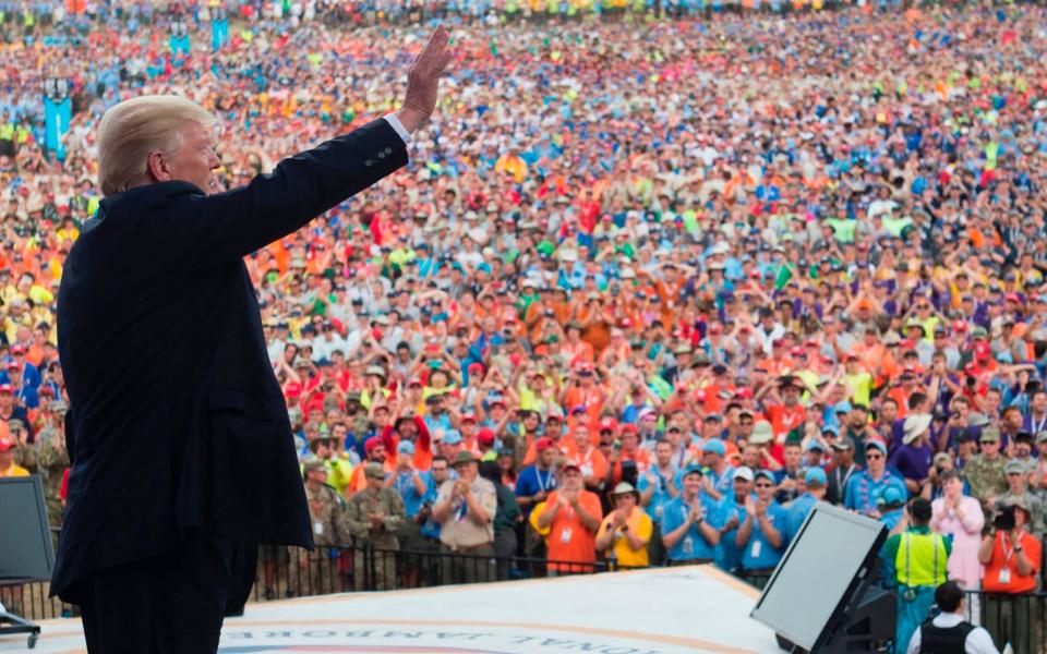 US President Donald Trump waves after speaking to Boy Scouts during the National Boy Scout Jamboree at Summit Bechtel National Scout Reserve in Glen Jean, West Virginia - Credit: AFP