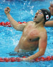 BEIJING - AUGUST 11: Kosuke Kitajima of Japan celebrates finishing the Men's 100m Breaststroke Final in first place and wins the gold medal held at the National Aquatics Center on Day 3 of the Beijing 2008 Olympic Games on August 11, 2008 in Beijing, China. Kosuke Kitajima of Japan finished the race in first place in a time of 58.91 and wins the gold medal and set a new World Record. (Photo by Shaun Botterill/Getty Images)